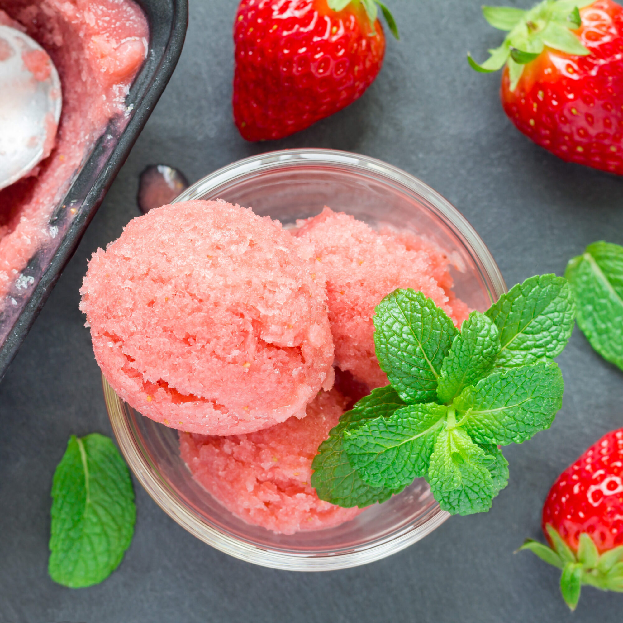 Homemade strawberry sorbet in glass, top view, square format